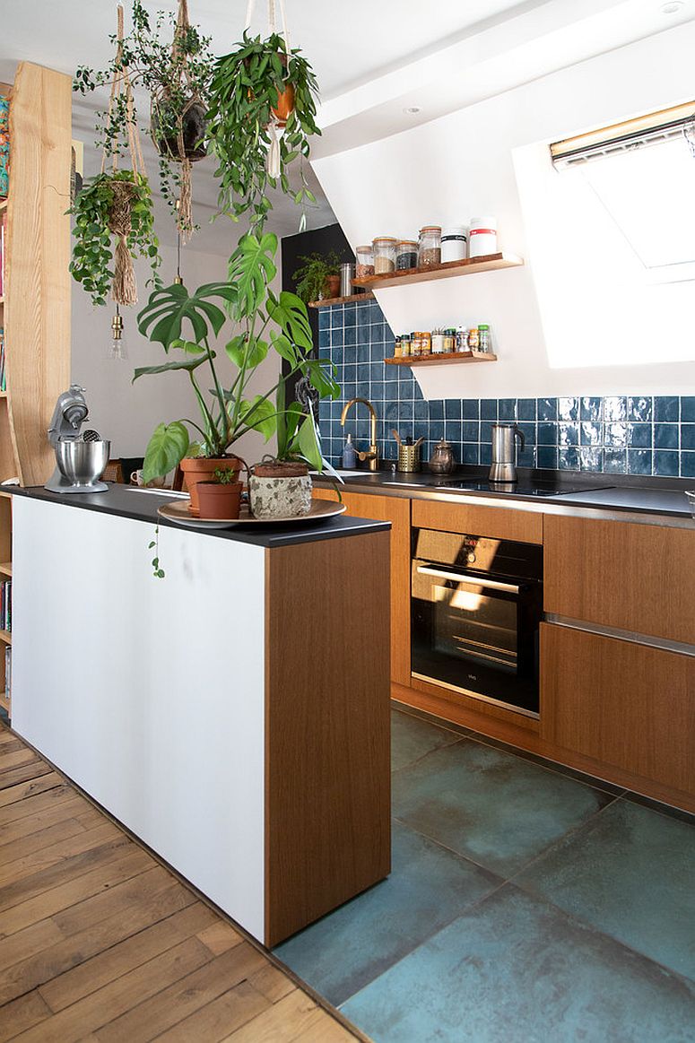 Polished eclectic kitchen of small Paris home with smart cabinets