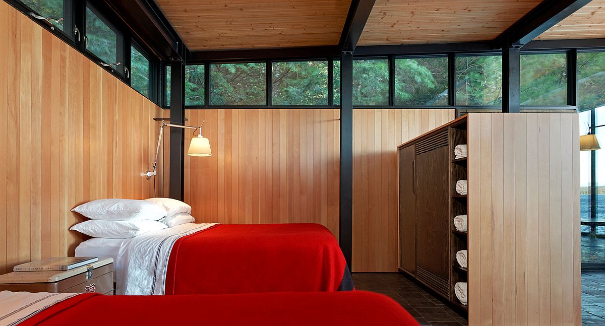 Relaxing and minimal bedroom of the Boat house with bedding in red