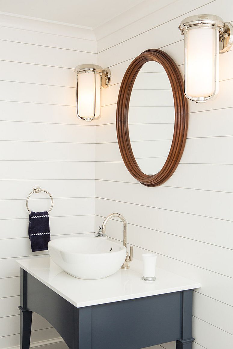 Small coastal themed powder room plays down the beach-inspired elements and looks more modern