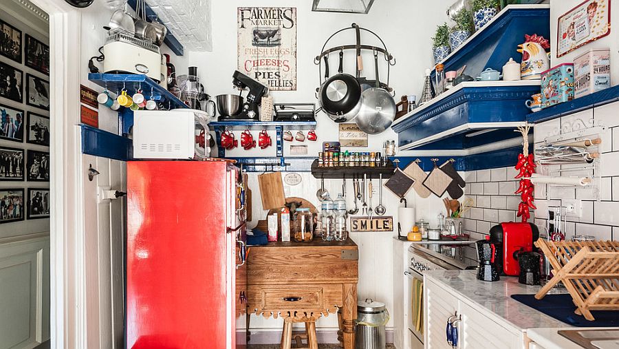 Small eclectic kitchen turns to wall space for organization