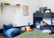 Smart-little-bunk-bed-in-blue-in-the-corner-keeps-things-casual-and-efficient-217x155