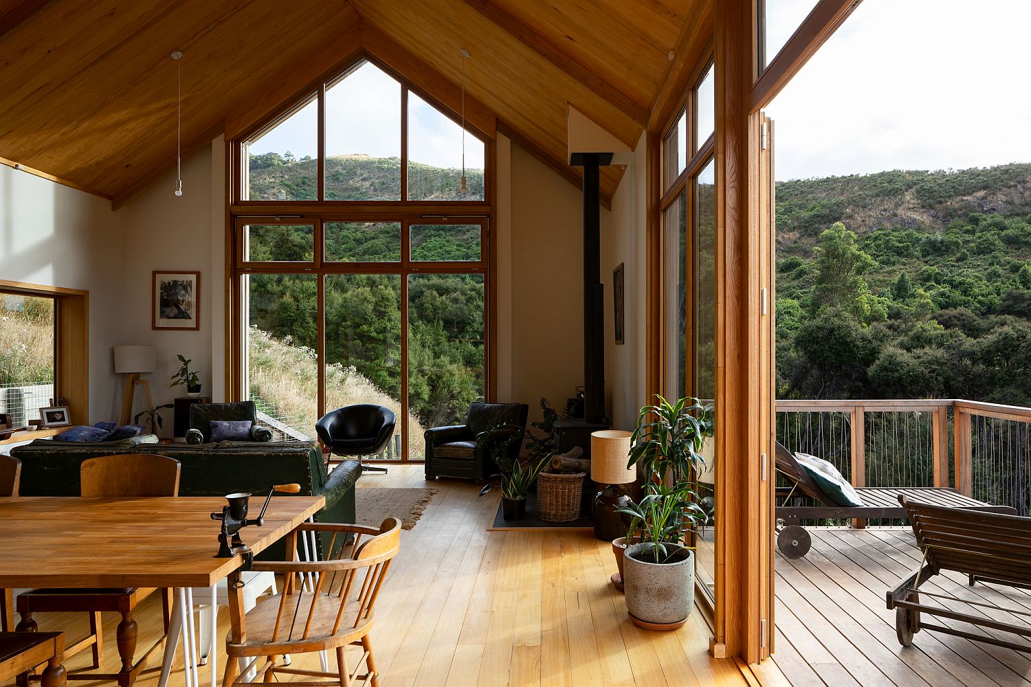 Spacious living area of the house in wood connected with the outdoors