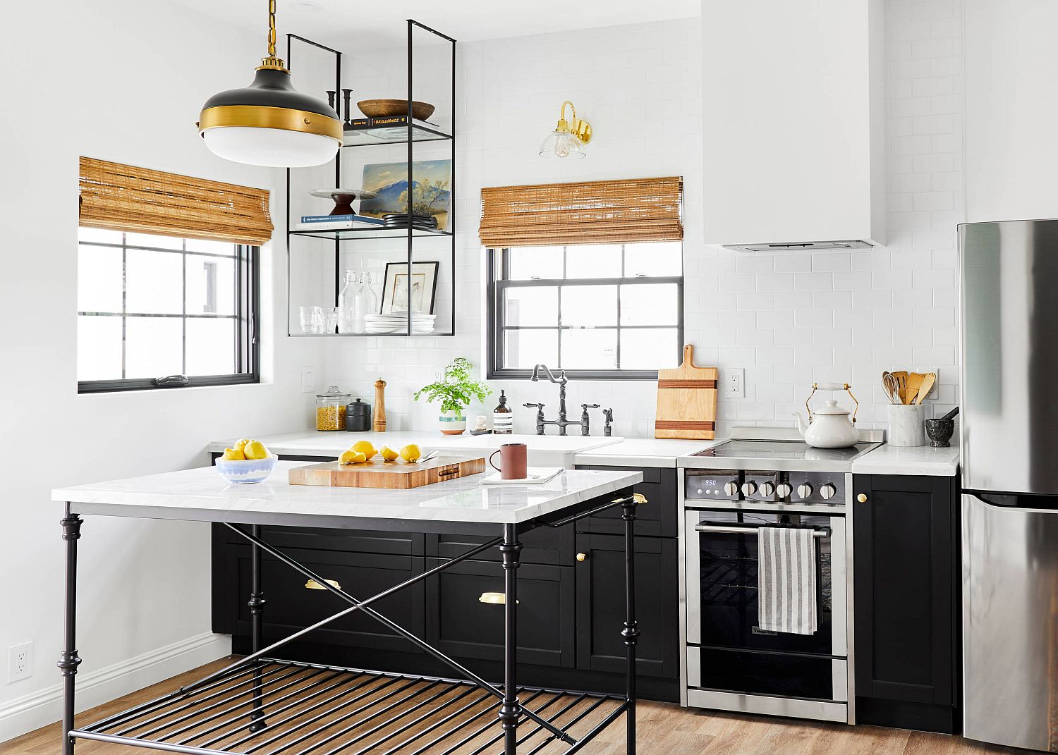 Backdrop, pendant and natural light come together to shape this lovely kitchen