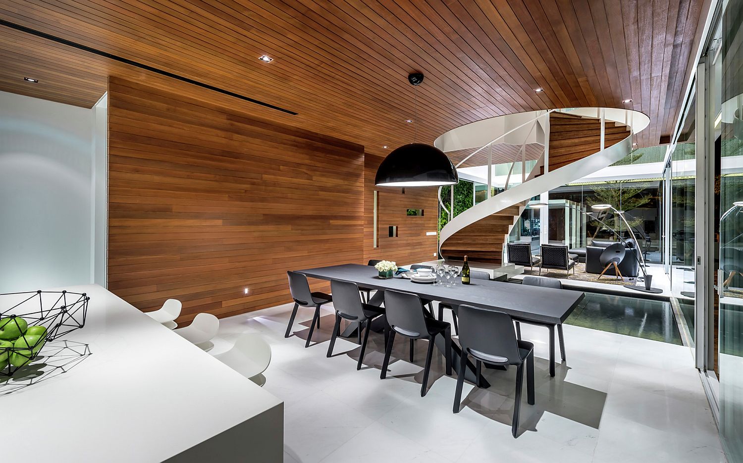 Dining area and kitchen of the house with wooden ceiling