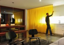 Floor-to-ceiling-drapes-on-either-side-of-the-living-area-help-in-increasing-privacy-217x155
