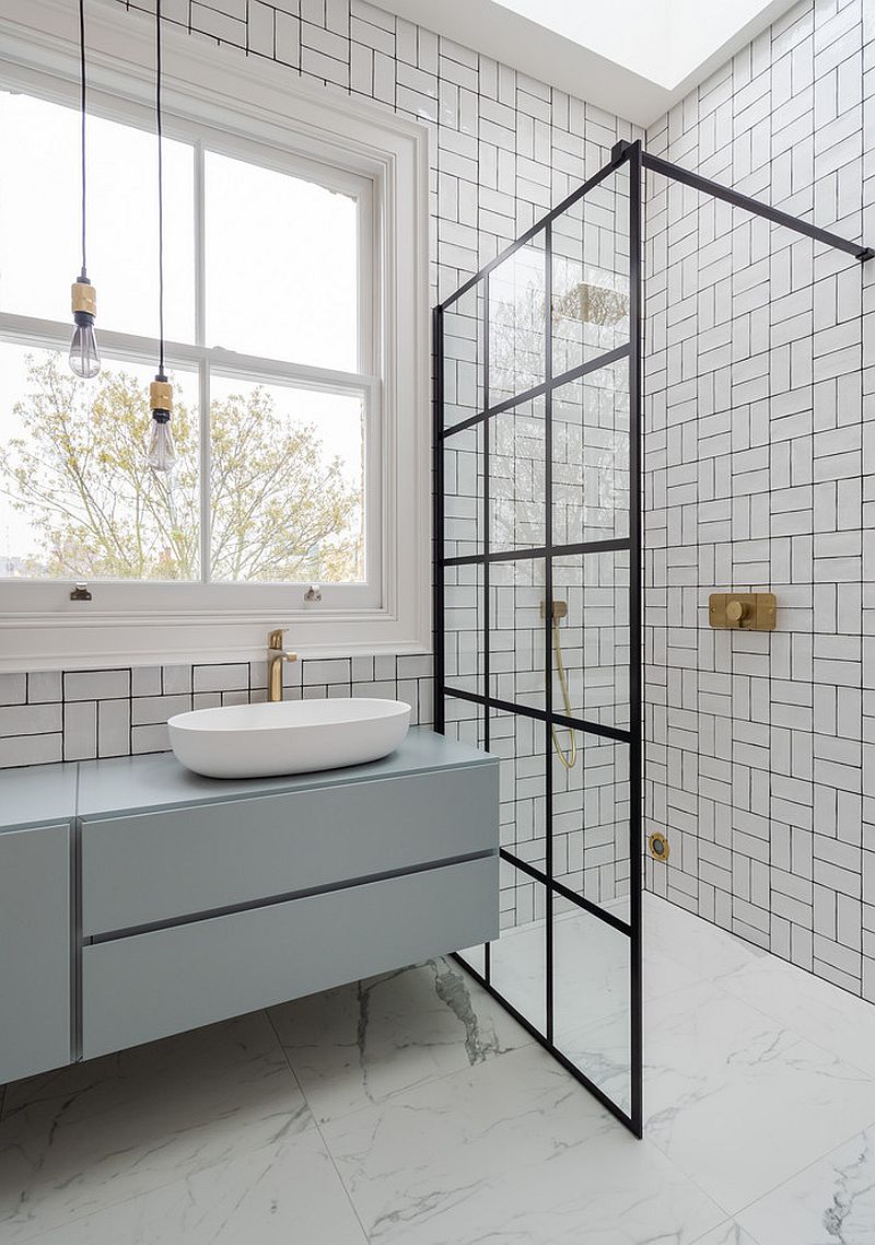 Glass shower area of the bathroom ushers in a hint of black