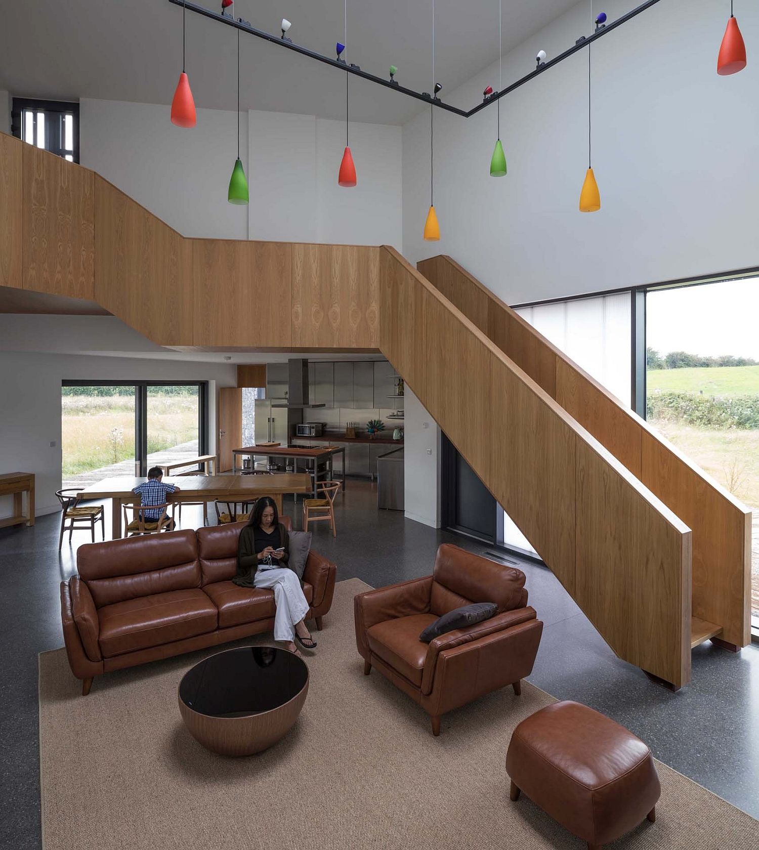 Living-room-of-the-house-illuminated-using-colorful-pendants