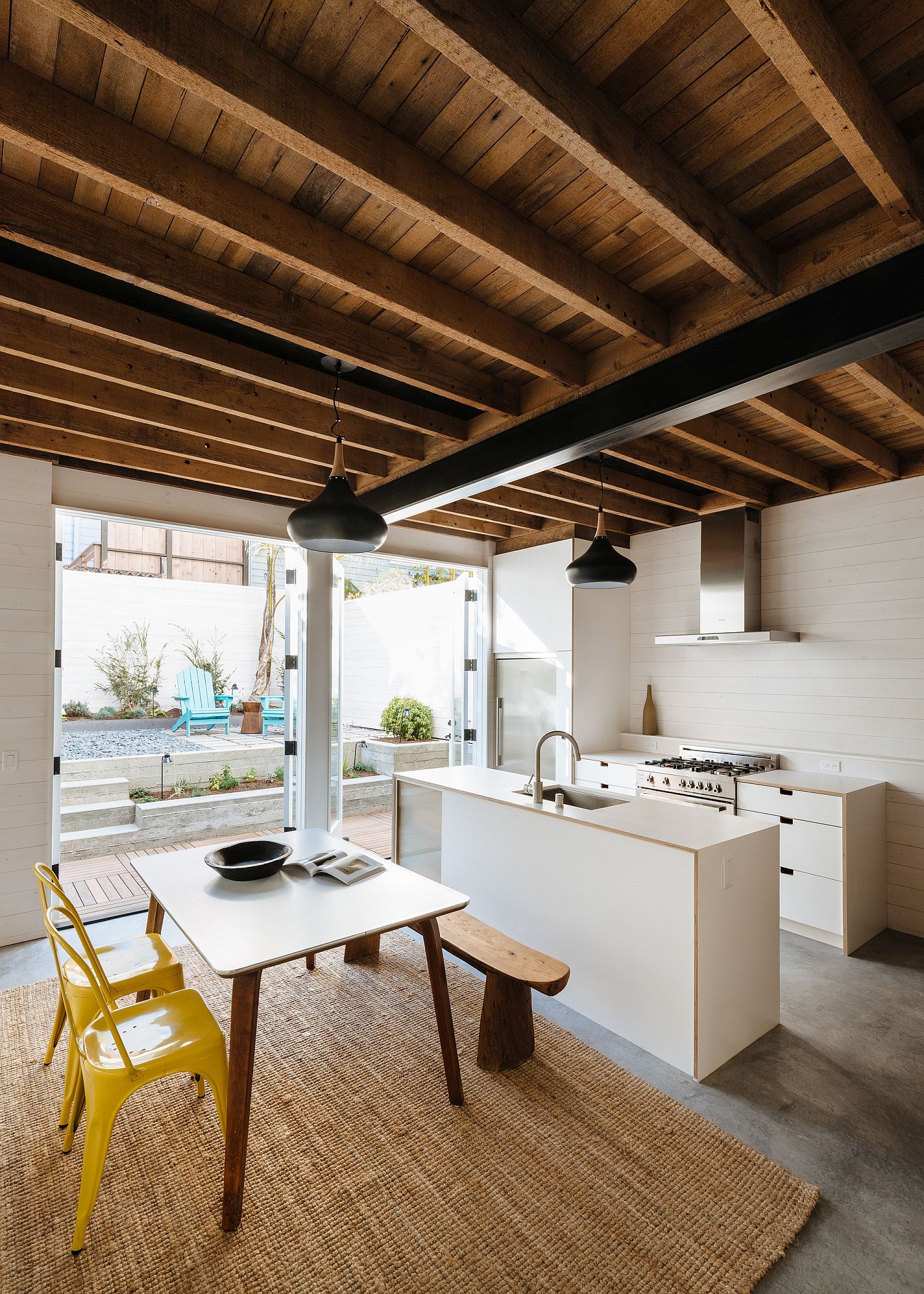 New kitchen and dining room of the house connected with the small rear yard