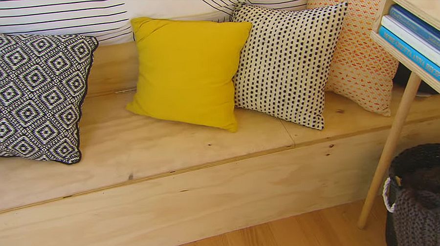 Pillows add color and style to the woodsy cabin interior