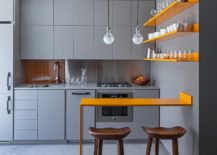 Posh-contemporary-kitchen-in-gray-with-twin-pendants-above-the-counter-217x155