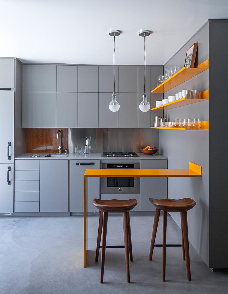 Posh contemporary kitchen in gray with twin pendants above the counter