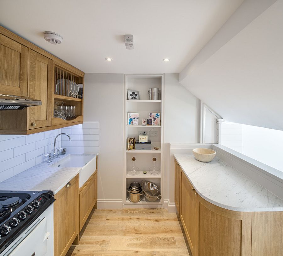 Tiny-white-and-wood-kitchen-with-a-small-window-that-brings-in-ample-light