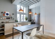 Trio-of-copper-pendants-along-with-the-window-lights-up-the-modets-kitchen-217x155