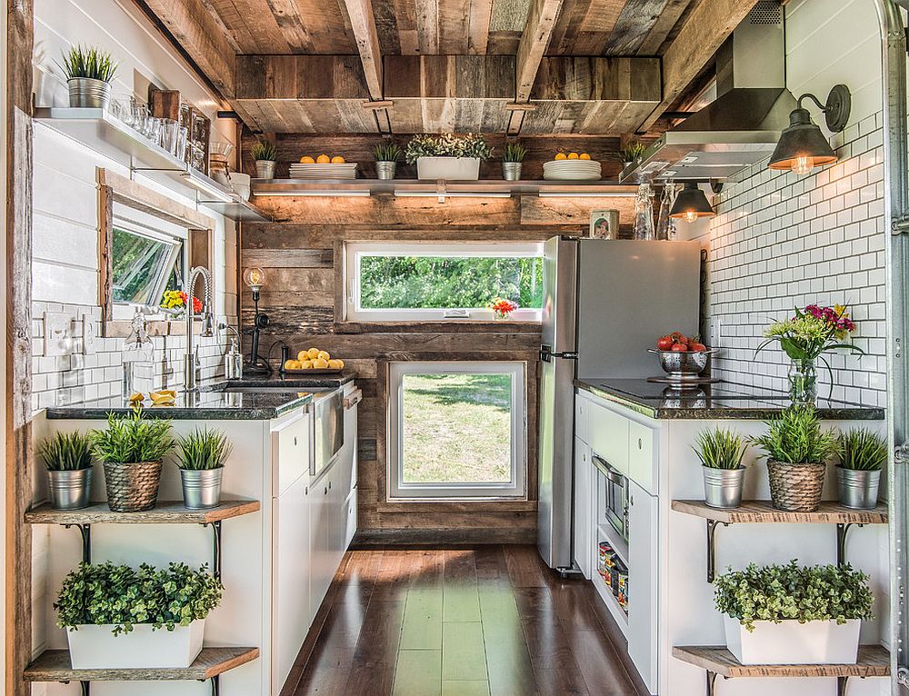 Use of multiple windows to light up the small industrial kitchen with ample woo