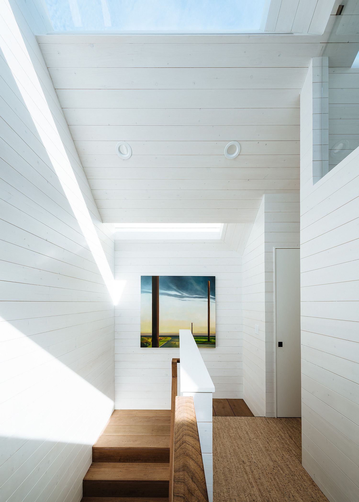 White and wood interior of the house with ample natural light