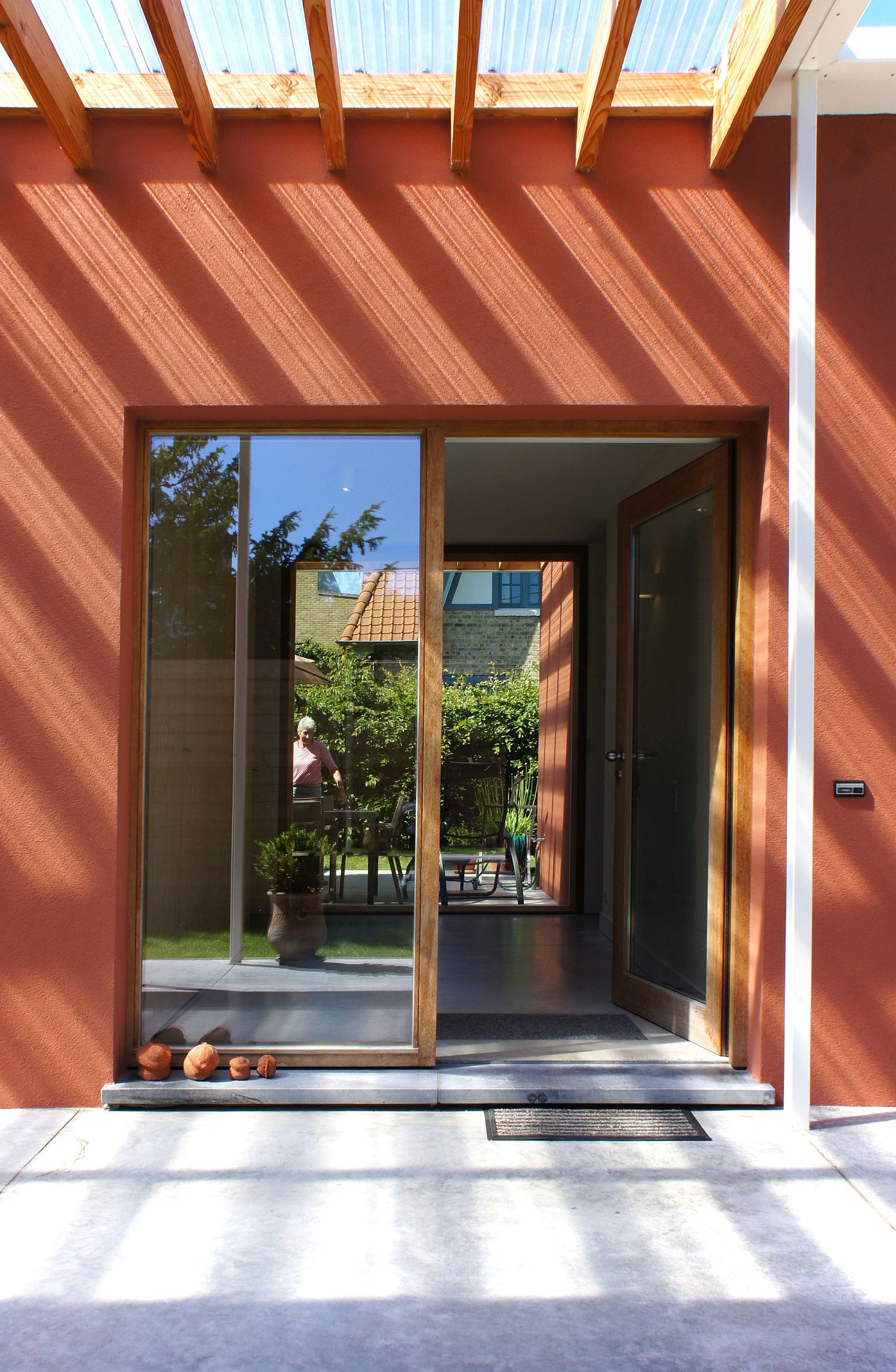 Bright orange exterior with reddish tint gives the home a Moroccan appeal