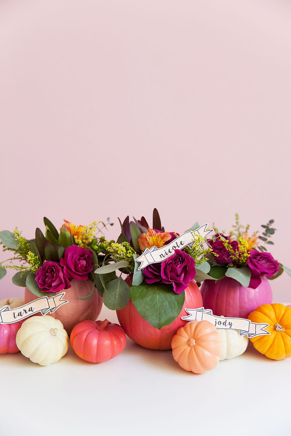 Colorful pumpkins and flowers brought together beautifully for fall charm