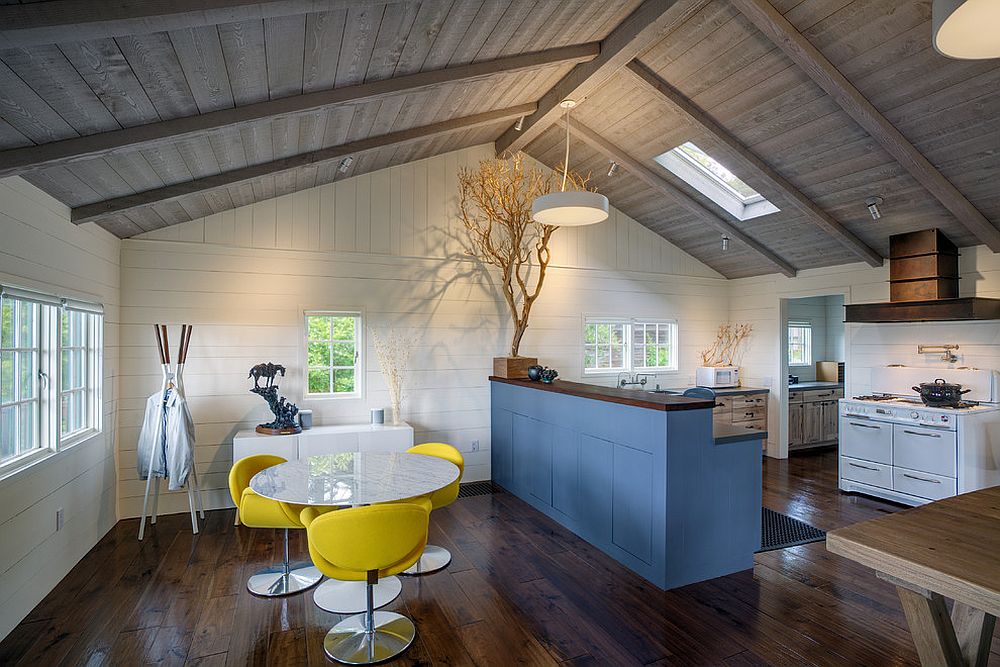 Eye-catching island brings blue to this lovely white kitchen