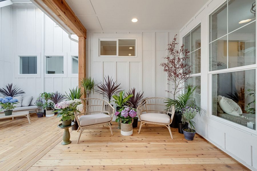 Farmhouse style deck is just incomplete with a healthy dose of greenery