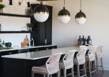 Lighting-fixtures-kitchen-island-and-curated-cabinets-bring-black-and-brass-to-this-kitchen-217x155