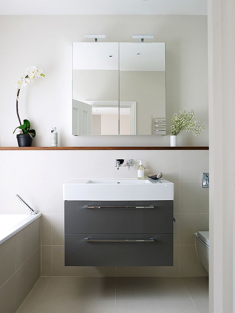 Mirrored medicine cabinets give the bathroom a more sophisticated look