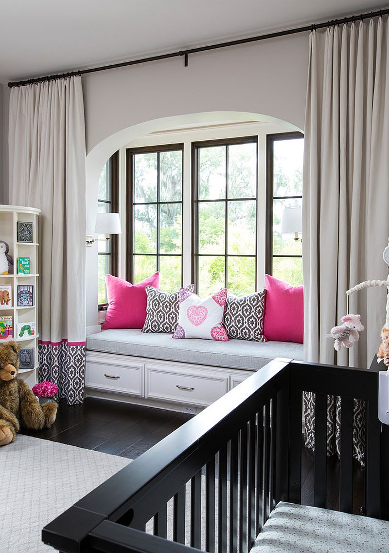 Modern Mediterranean style nursery with a window seat that offers additional storage space