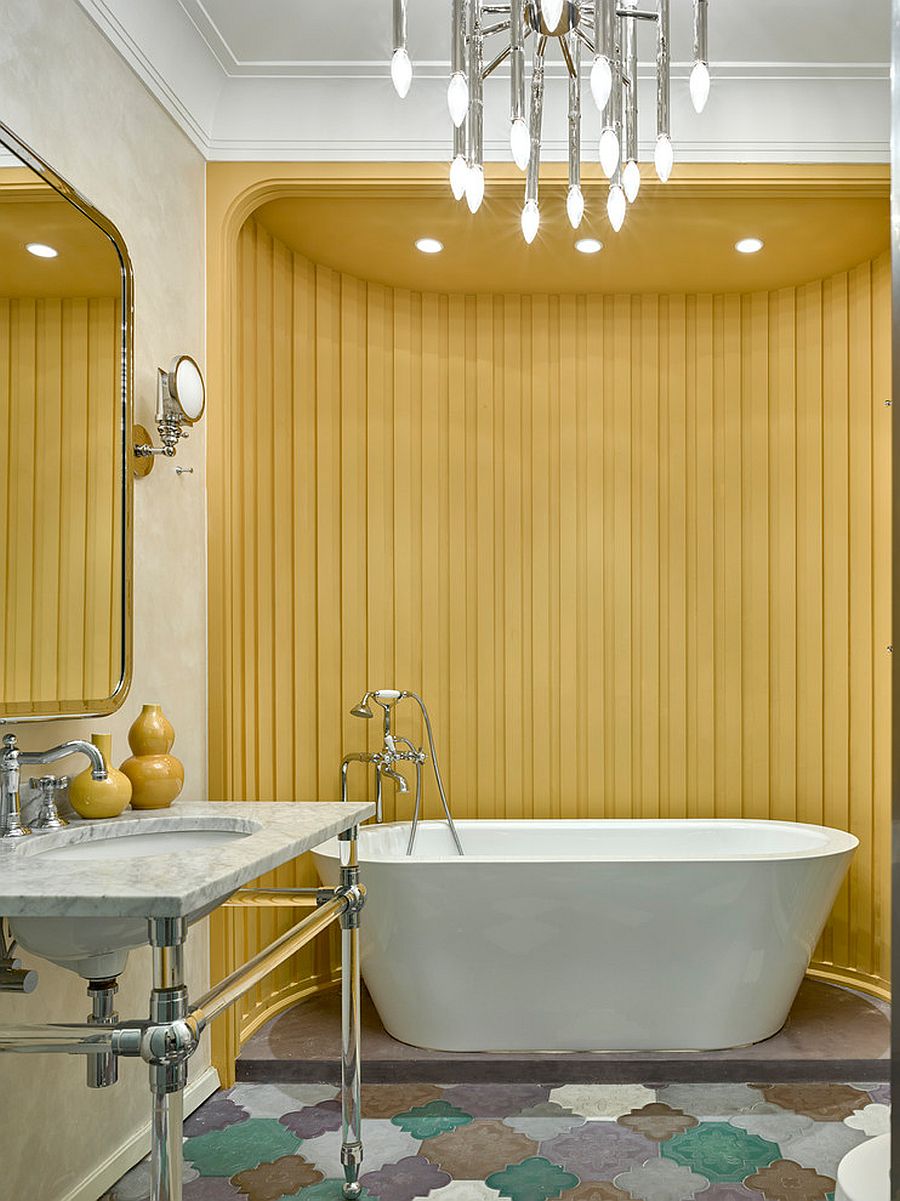 Striped accent wall in yellow for the unique bathroom in white