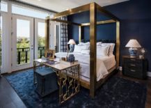 Stunningly-beautiful-four-poster-bed-and-table-in-brass-for-the-bedroom-in-dark-blue-217x155