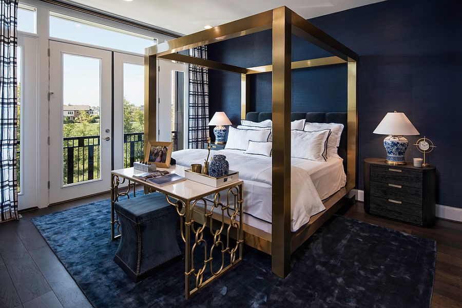Stunningly beautiful four-poster bed and table in brass for the bedroom in dark blue