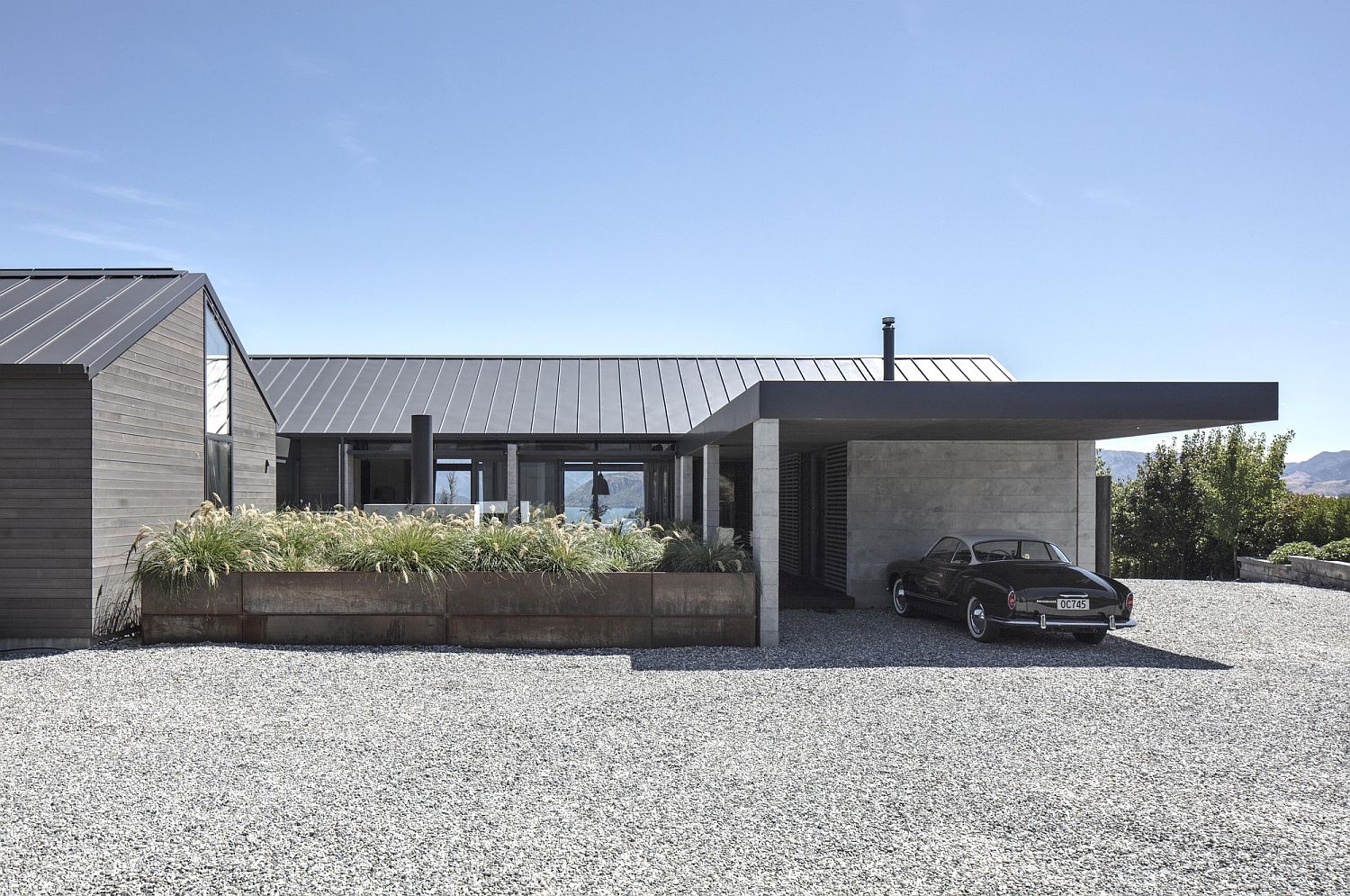 Thermomass panels, Corten steel and smoked carbon stained timber exterior of the New Zealand house