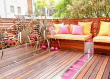 Throw-pillows-bring-pink-ad-orange-to-the-outdoor-deck-217x155