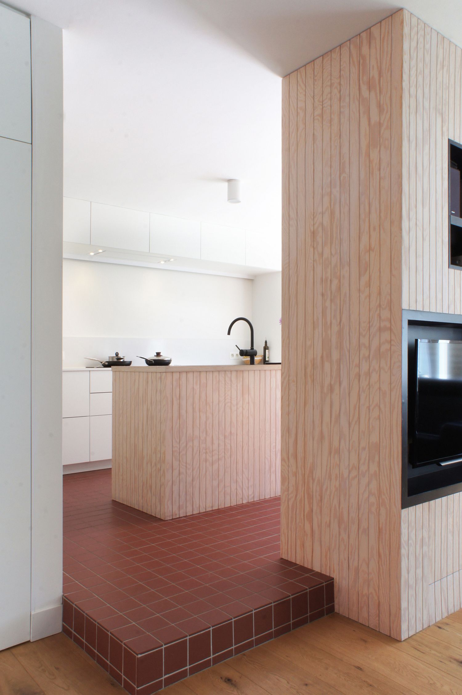 Tiles add color to the otherwise neutral kitchen