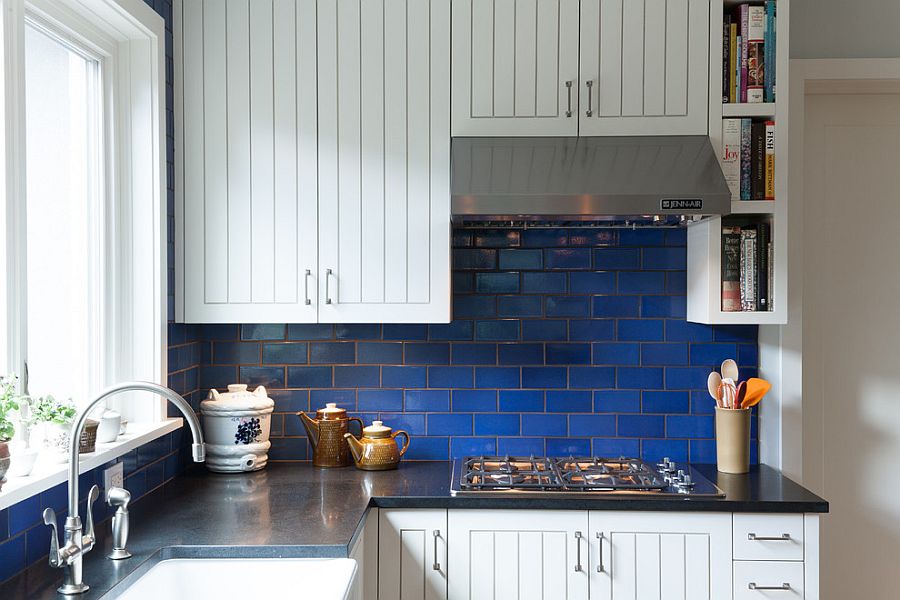 Tiny kitchen in white with beautiful dark blue-tiled backsplash