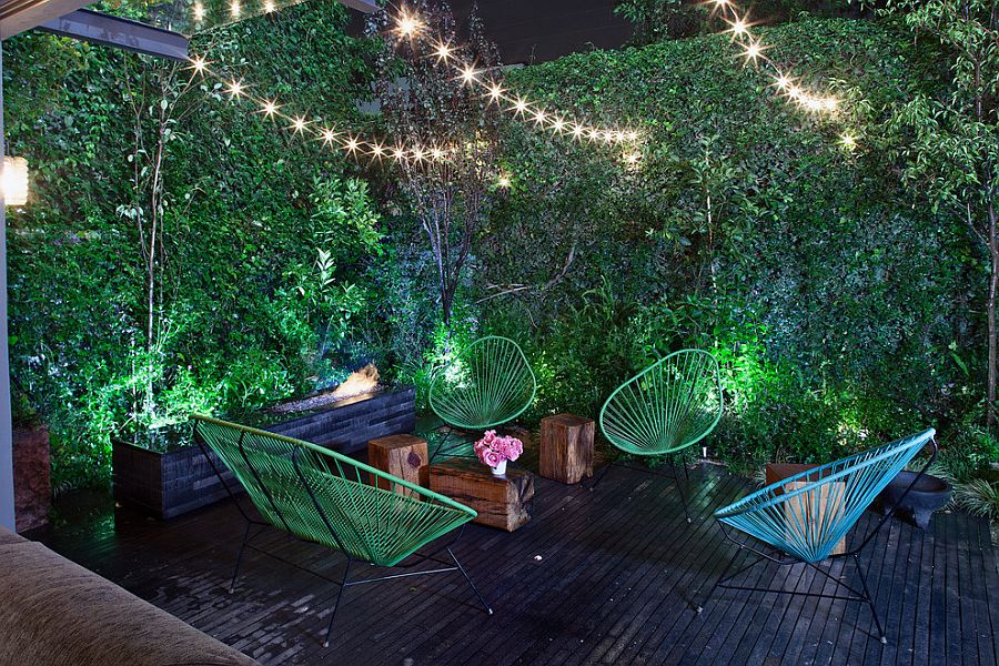 Turn-the-small-and-private-deck-into-a-romantic-getaway-with-string-lighting-and-colorful-chairs