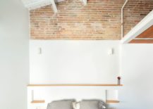 Wallpainted-in-white-along-with-ceiling-beams-and-brick-wall-section-for-the-small-bedroom-217x155