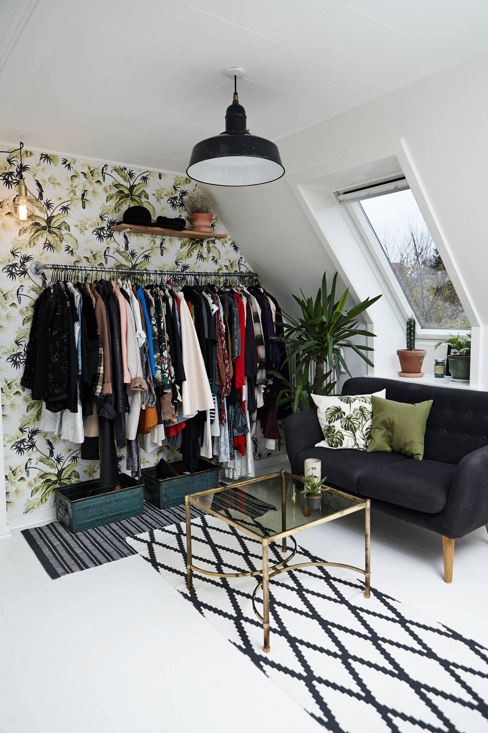 Wallpaper in the backdrop adds color to the standalone closet unit