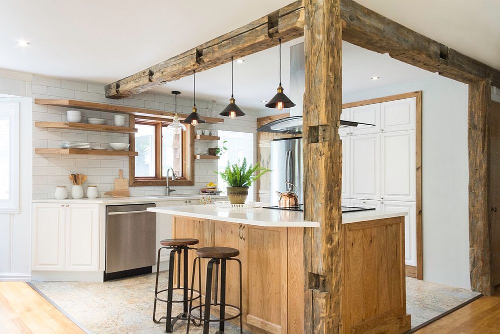 Weathered wooden beams bring a unique character to the kitchen in white