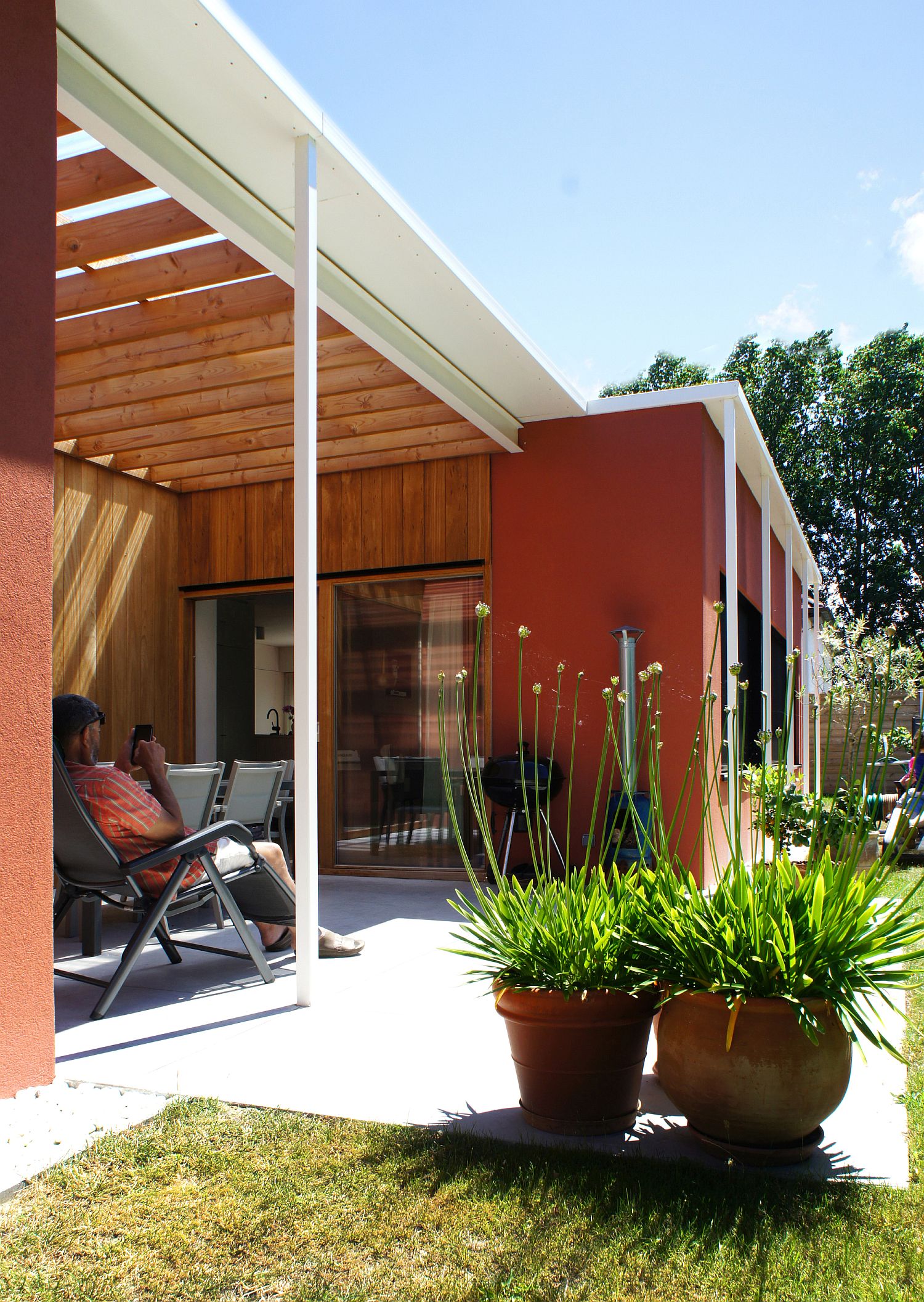 White and wood pergola structure of the house