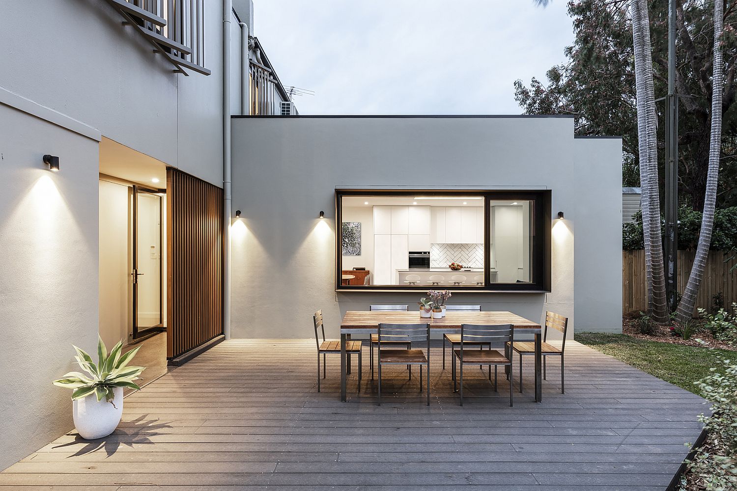 Wooden deck and outdoor dining area of the houe is a showstopper