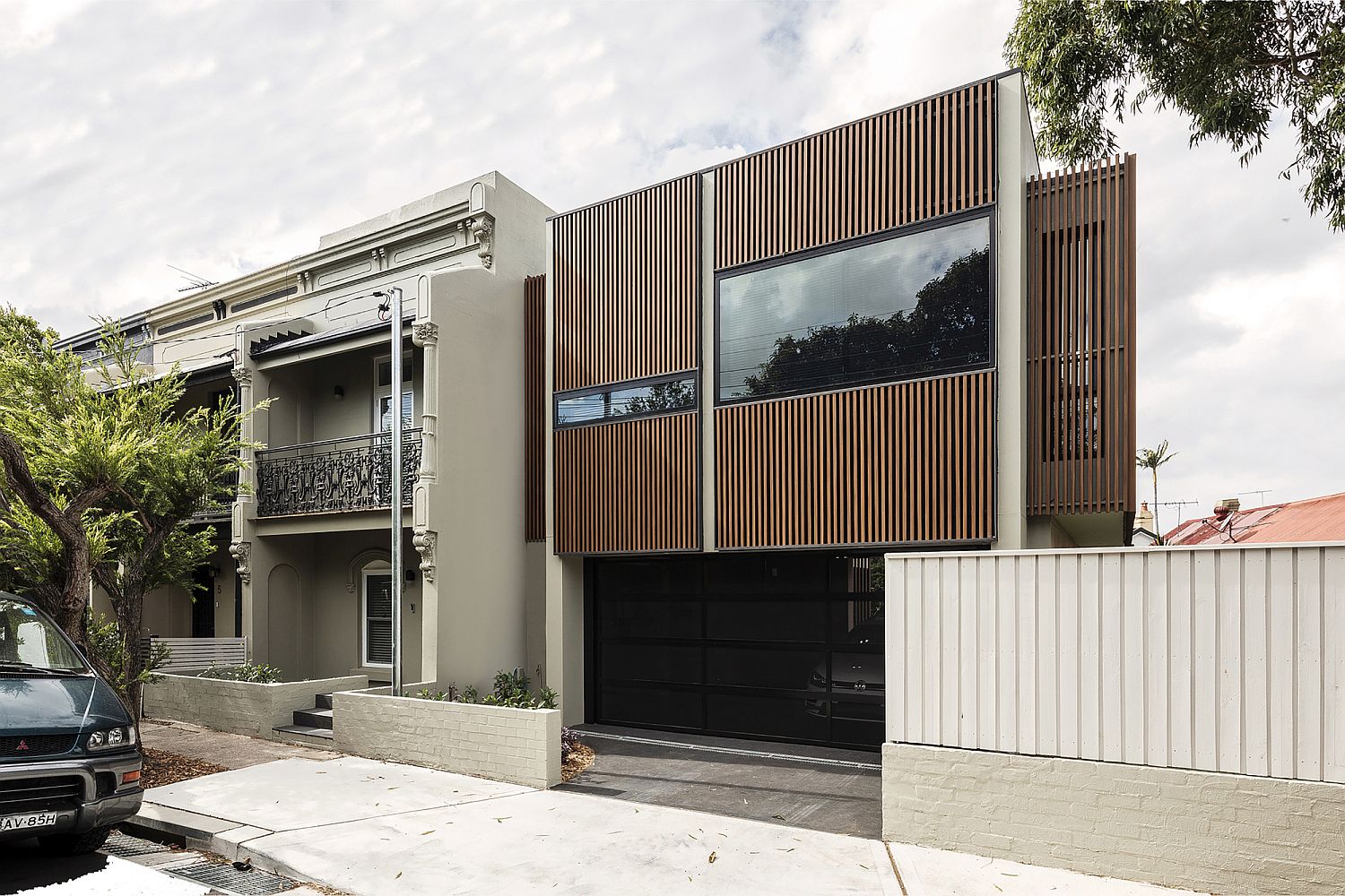 Wooden street facade of the house blends the old with the new in a lovely manner