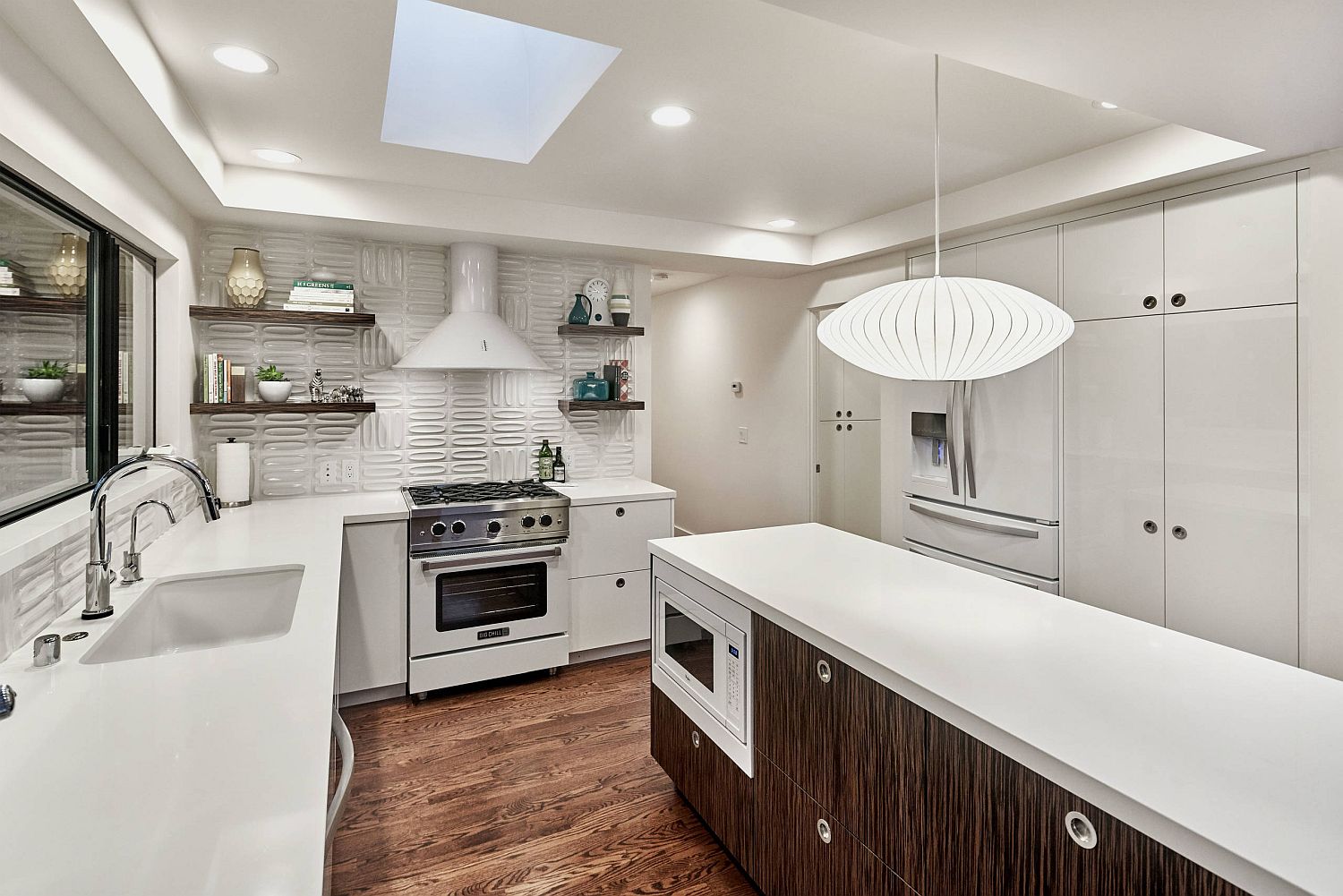 All-white kitchen with a 3d-tiled backsplash that adds pattern without altering the color scheme