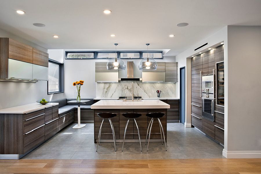 Beautiful kitchen with wooden cabinets and marble backsplash