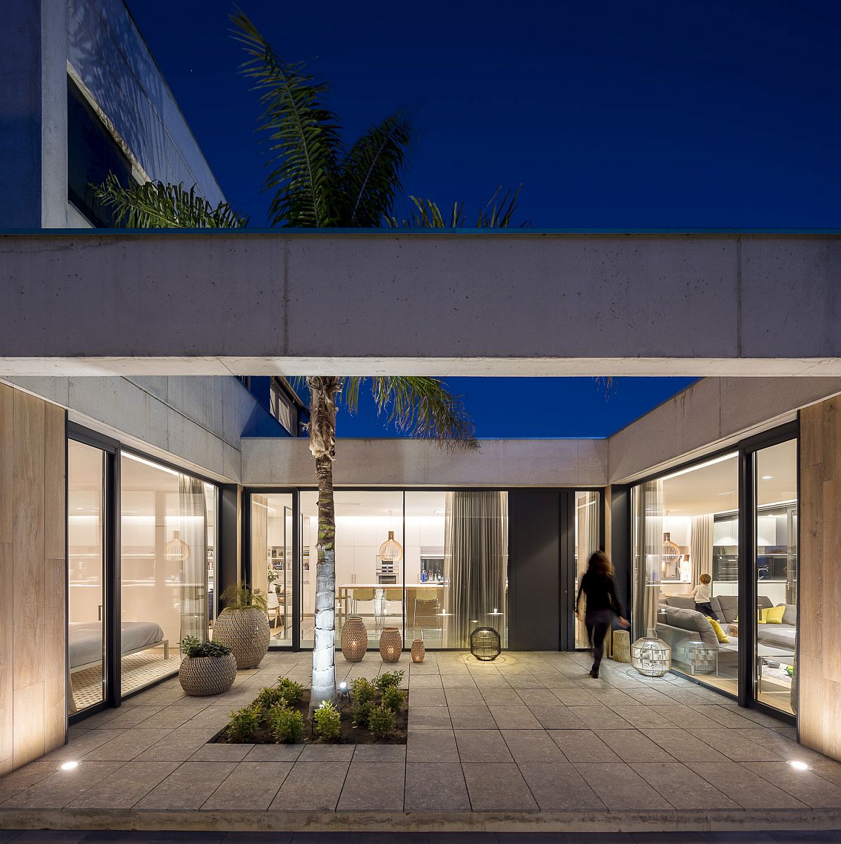 Beautiful lighting adds to the inviting ambiance of the central porch