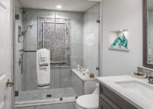 Beautiful-little-glass-dolphin-is-the-only-fetaure-that-adds-color-to-this-contemporary-gray-bathroom-217x155