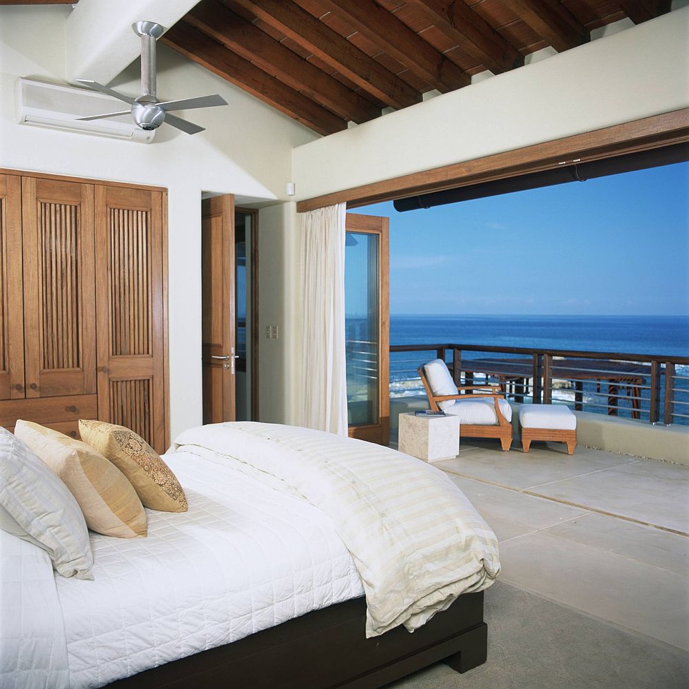 Bedroom-of-the-vacation-home-with-tropical-style-has-a-relaxing-appeal-and-connecivity-with-outdoors