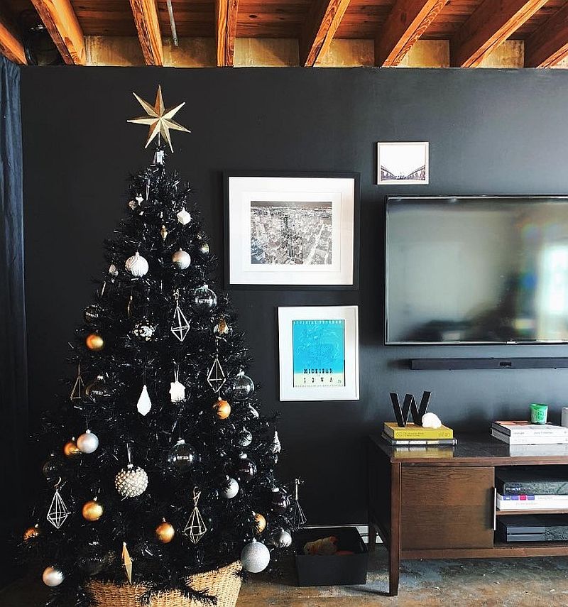 Black Christmas tree with golden star topper.