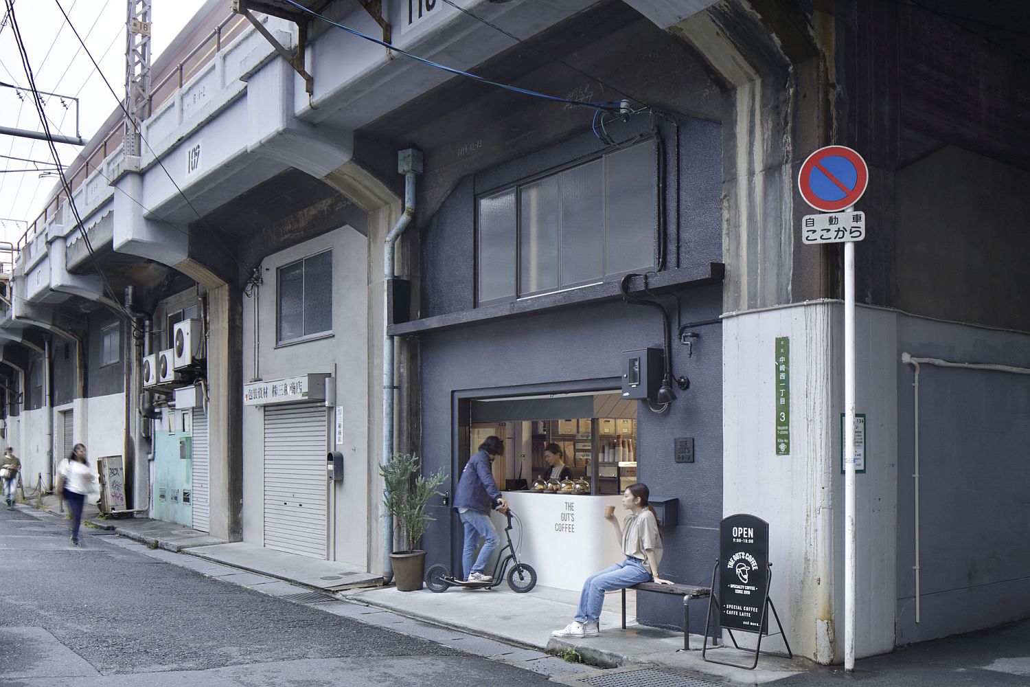 Bluish-gray and white interior of the coffee shop feels modern and Scandinavian at the same time