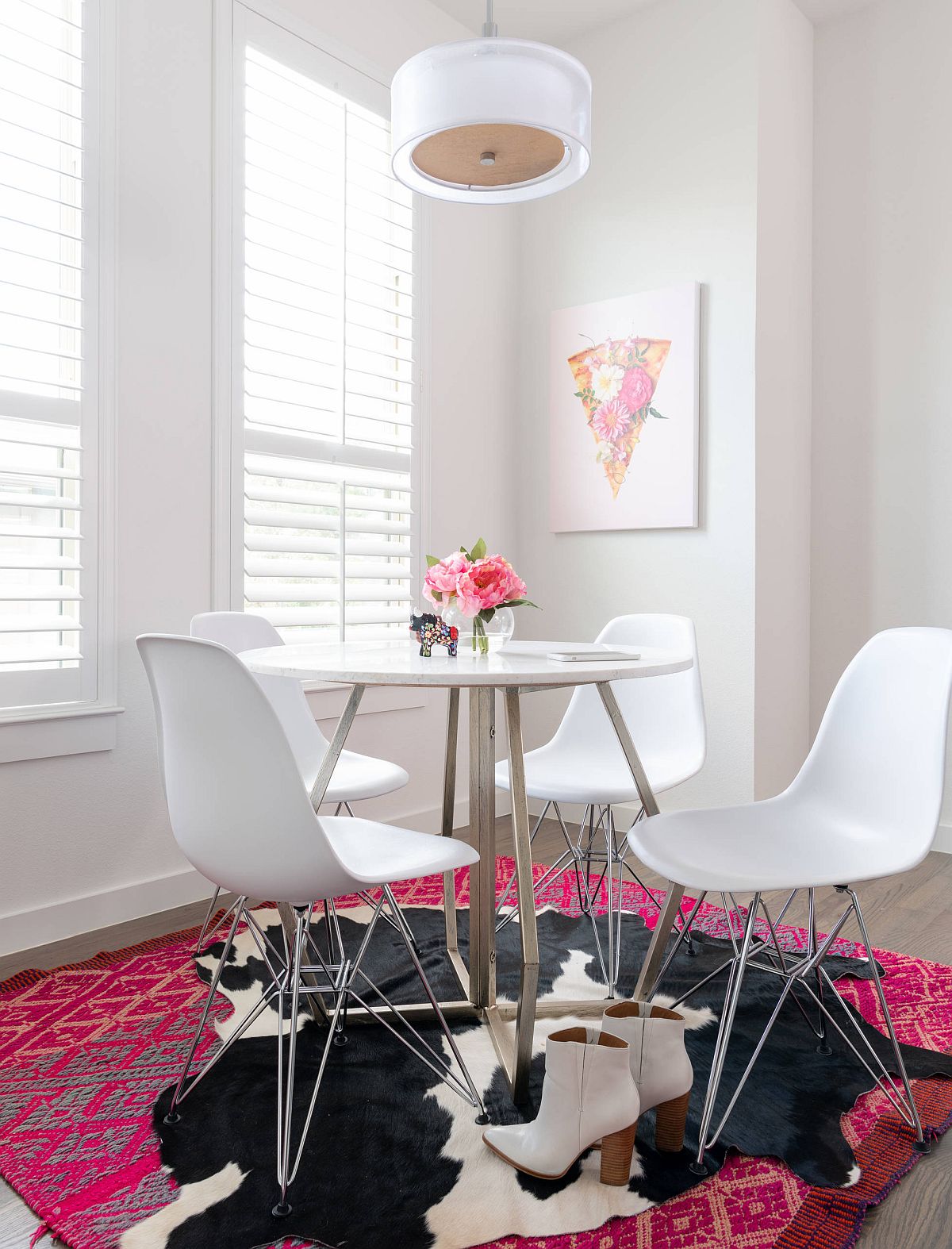 Bold and eclectic rug brings color and pattern to the small dining room