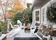 Bring-the-Holiday-Season-celebration-to-the-front-porch-with-some-chairs-and-a-Christmas-tree-in-the-corner-217x155