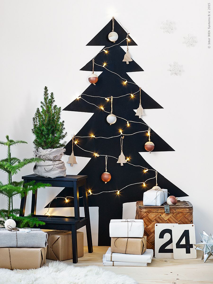 White wall with a black Christmas tree drawing.